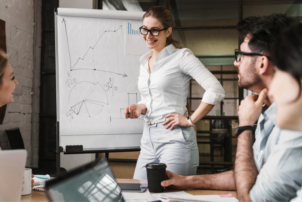A strategist presenting plans to her colleagues